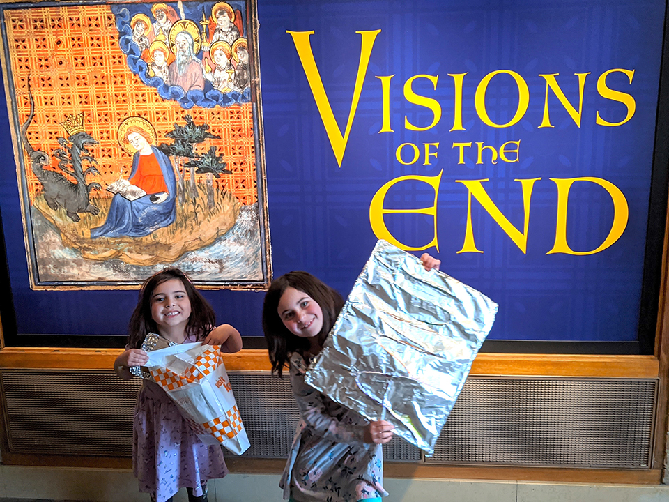 Adeline and Bernadette Di Salvo, daughters of theatre professor Gina Di Salvo, show off their Visions of the End inspired art projects at Family Medieval Day.